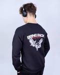 Person wearing a black sweatshirt with a design and text on the back, standing against a light gray background.