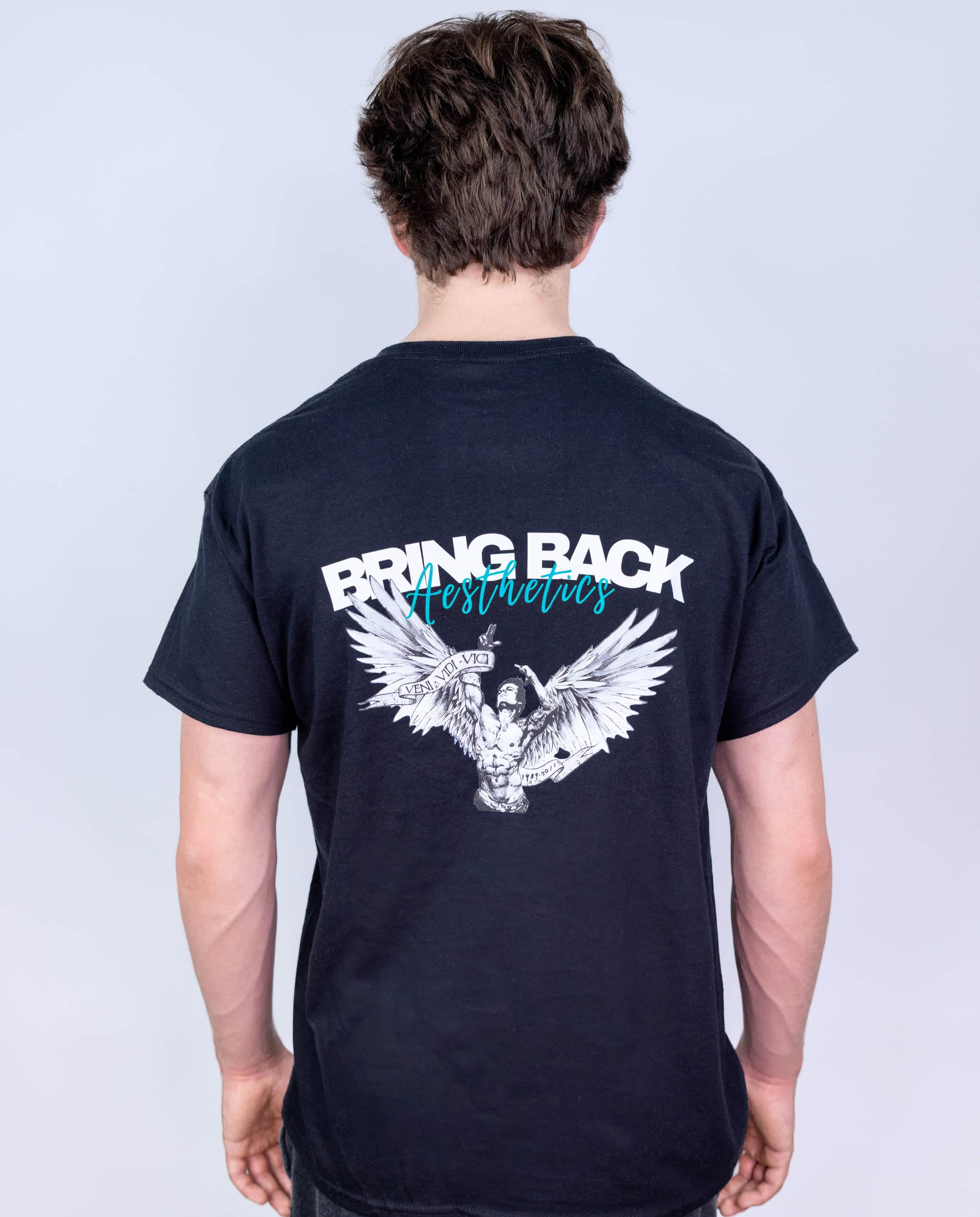 Person wearing a black t-shirt with 'Bring Back Aesthetics' design on the back against a light gray background